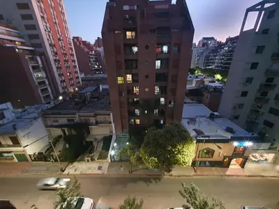 a tall building in a city at night at LOAN Nueva Cordoba 6A in Cordoba