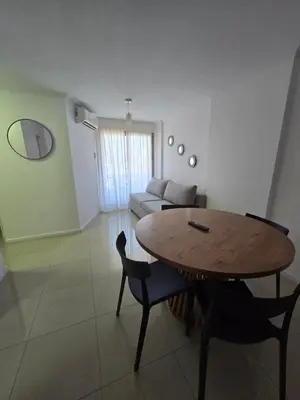 a living room with a table and a couch at LOAN Nueva Cordoba 9E in Cordoba
