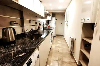 a kitchen with a sink and a counter top at LOAN Nueva Cordoba categoría appart 7B in Cordoba