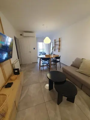a living room with a couch and a table at LOAN Nueva Cordoba categoría appart 7B in Cordoba