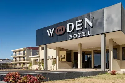 a building with a sign for a hotel at Wooden Hotel in Villa Carlos Paz