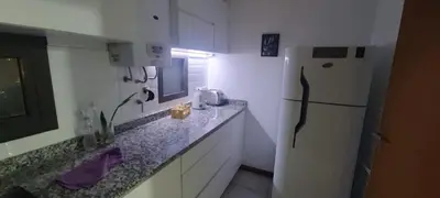 a kitchen with a refrigerator and a counter top at Aparts Kodu- Residencia Familiar in Río Cuarto