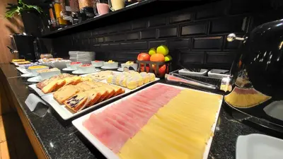a buffet line with many different types of food at THE HOTEL in Cordoba