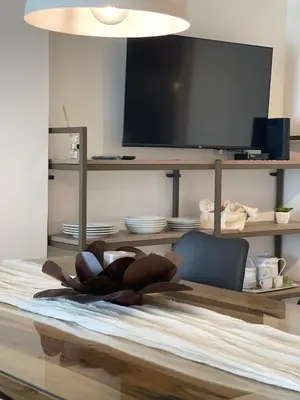 a person laying on a table in a living room at DEPARTAMENTO CENTRICO CON COCHERA - CORDOBA Argentina- in Cordoba