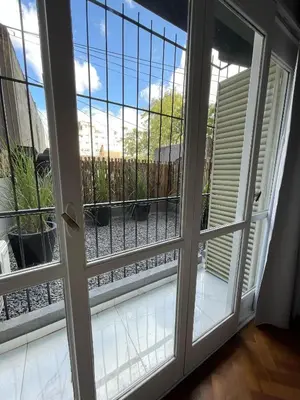 a sliding glass door with a view of a patio at DEPARTAMENTO CENTRICO CON COCHERA - CORDOBA Argentina- in Cordoba