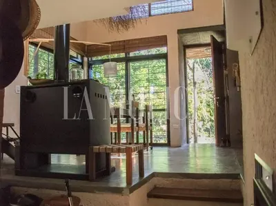 a kitchen and dining room with a large glass door at La Molicie, Achiras Arriba in San Javier