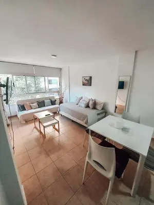 a living room with a couch and a table at Departamento en la mejor zona de GENERAL PAZ in Cordoba