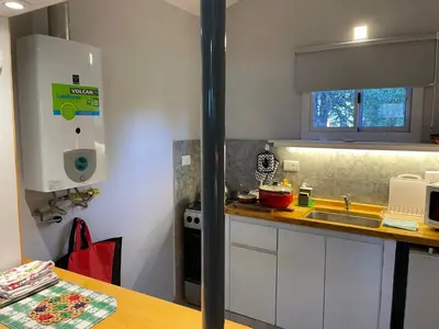 a kitchen with a sink and a counter top at CasitaLiu in Villa General Belgrano