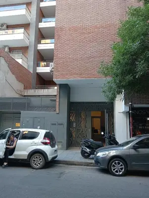 a couple of cars parked on the side of a street at Departamento Boho Chic Corazón de Nueva Córdoba in Cordoba