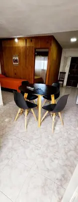 a dining room with a table and two chairs at Lo de Liliana in Tanti