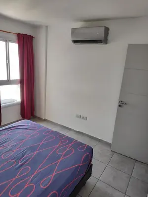 a bedroom with a bed and a window at ALTOS DE CLERMONT in Cordoba