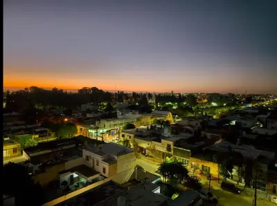 a view of a city at night with lights at ALTOS DE CLERMONT in Cordoba