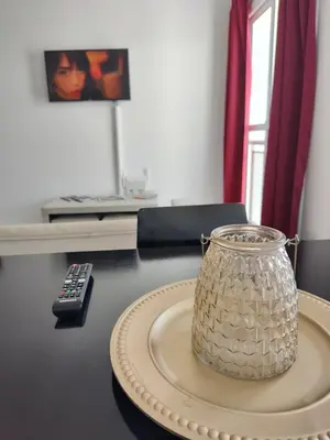 a glass jar on a table with a remote control at ALTOS DE CLERMONT in Cordoba
