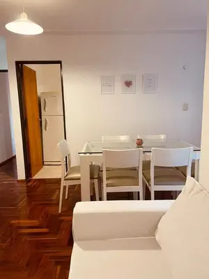 a dining room with a table and chairs at LitStay - Departamento con Cochera Barrio General Paz in Cordoba