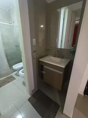 a bathroom with a sink and a shower and a toilet at Departamento centrico Carlos Paz in Villa Carlos Paz