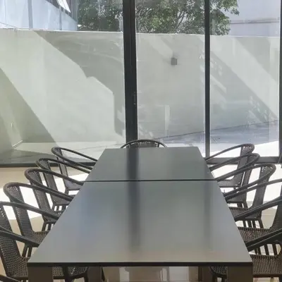 a table and chairs in a room with a window at LOCADOR Nueva Cordoba 5B in Cordoba