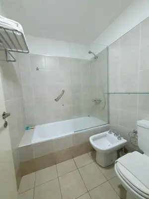 a bathroom with a tub and a toilet and a sink at LOCADOR Nueva Cordoba 5B in Cordoba