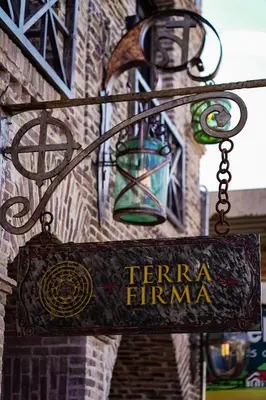 a sign that says ferra firmma hanging from a building at Terra Firma Hotel Boutique in Villa Carlos Paz