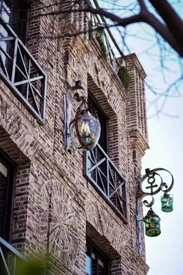 a brick building with two lights on the side of it at Terra Firma Hotel Boutique in Villa Carlos Paz