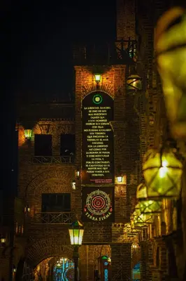 a building with a sign on the side of it at night at Terra Firma Hotel Boutique in Villa Carlos Paz