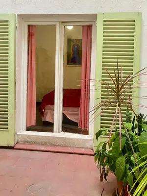 a window of a house with a bed in it at Plazoleta Apartamento in Cordoba