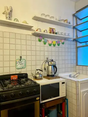 a kitchen with a stove and a tea kettle at Plazoleta Apartamento in Cordoba