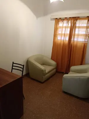 a living room with a couch and a chair at Salguero Centric Apartaments D2 in Cordoba