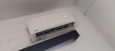 a toaster oven sitting in a white wall at Salguero Centric Apartaments D2 in Cordoba