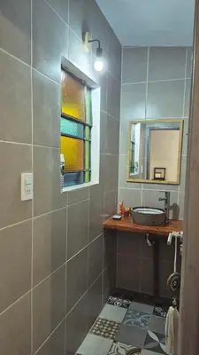 a bathroom with a sink and a mirror at Casa Del Valle Traslasierra in Las Chacras (La Paz)