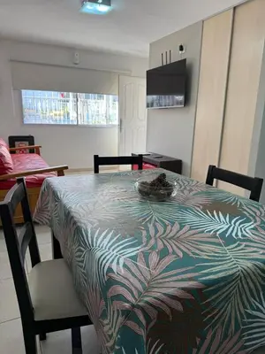 a dining room table with a patterned table cloth on it at Brisas del Sur in Villa Carlos Paz