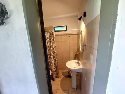 a small bathroom with a sink and a toilet at Casa Calo Bialet Massé in Bialet Massé