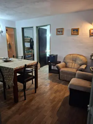 a living room with a table and chairs and a couch at Casa Calo Bialet Massé in Bialet Massé