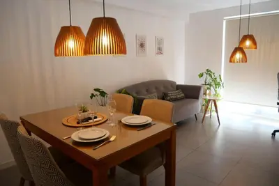 a living room with a wooden table and chairs at A estrenar!Moderno, Nordic Nest in Cordoba