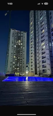 two tall buildings in a city at night at A estrenar!Moderno, Nordic Nest in Cordoba