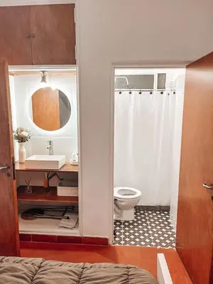 a bathroom with a toilet and a sink at Departamento zona CENTRO BOLIVAR y LA CAÑADA con BALCÓN in Cordoba