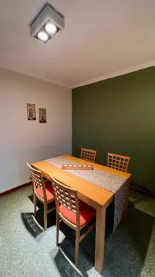a dining room with a table and four chairs at Verona in Cordoba
