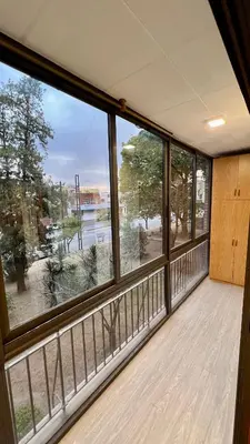 an empty room with large windows and a balcony at Verona in Cordoba