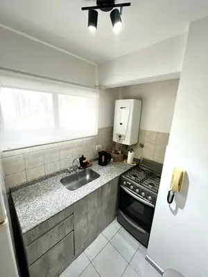 a kitchen with a sink and a stove at NUEVA CÓRDOBA - Vélez Sarsfield cerca del Allende y Oulton in Cordoba