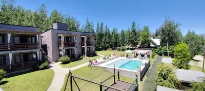 an aerial view of a house with a swimming pool at Gemas Apart in Villa Yacanto