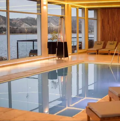 a swimming pool in a house with a view of the water at Departamento con vistas al lago en Veneto Village in Villa Parque Siquiman