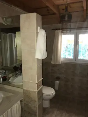 a bathroom with a toilet and a sink at LA CASONA in Villa General Belgrano
