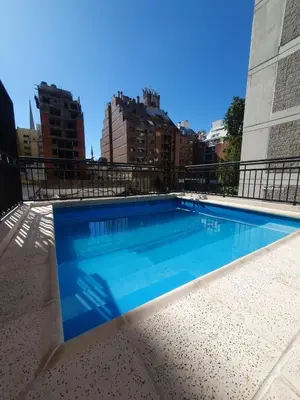 a swimming pool on top of a building at LOAN Nueva Cordoba 4E in Cordoba