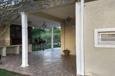 an open entry to a house with a patio at Confortable casa traslasierra. Vista al Champaqui in Quebrada de los Pozos