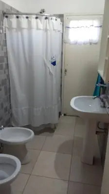 a bathroom with a shower and a toilet and a sink at Confortable casa traslasierra. Vista al Champaqui in Quebrada de los Pozos