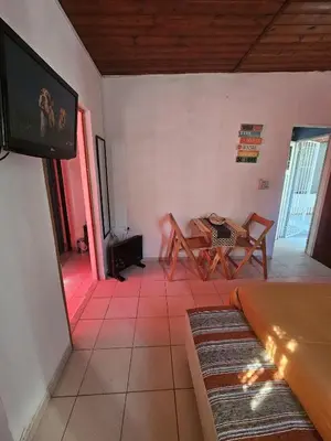 a living room with a table and a tv at Terraza Perito Moreno in Villa Carlos Paz