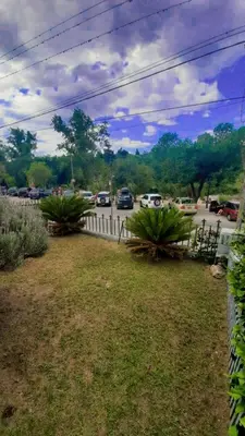 a yard with cars parked in a parking lot at Terraza Perito Moreno in Villa Carlos Paz