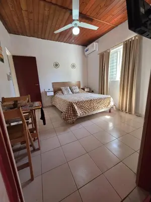 a bedroom with a bed and a wooden ceiling at Terraza Perito Moreno in Villa Carlos Paz