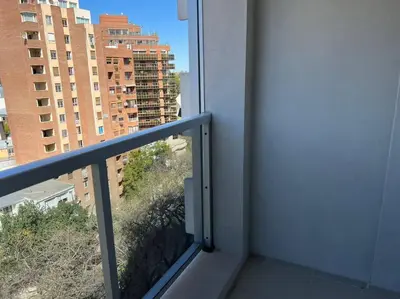 a balcony with a view of a building at Dpto Nva Cba, pileta seguridad, cochera in Cordoba