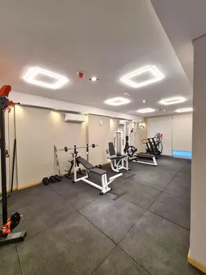 a gym with several treadmills and machines in a room at Dpto Nva Cba, pileta seguridad, cochera in Cordoba