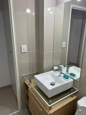 a bathroom with a sink and a mirror at Dpto Nva Cba, pileta seguridad, cochera in Cordoba